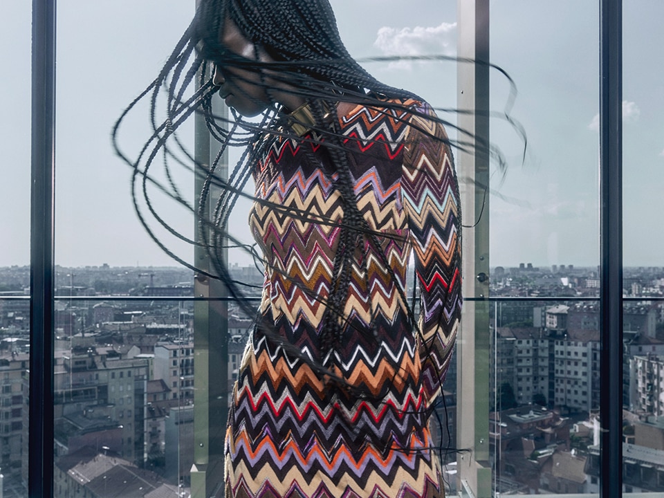 A model is wearing a multicolourse zig zag dress from the Fall Winter 2023 Collection