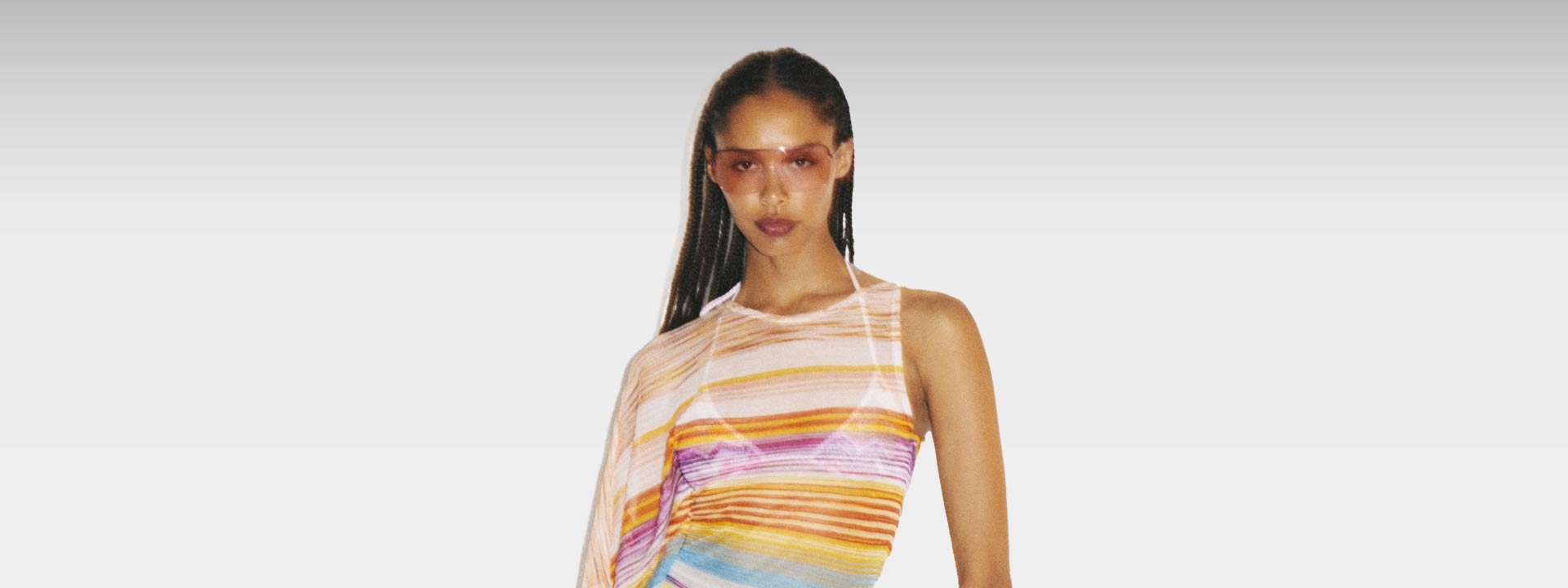 The model is wearing a multicolor dress from the Spring Summer 2023 mare collection