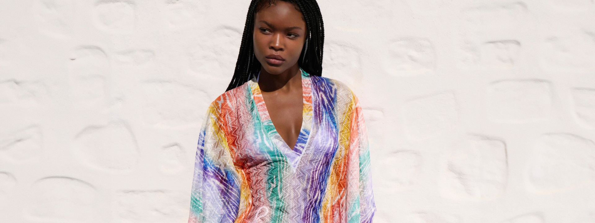 A model is wearing a multicolour cover up from the digital exclusive capsule