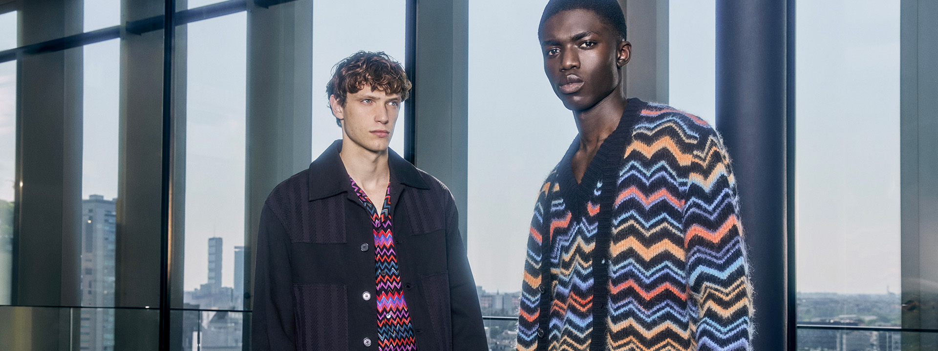 Two models are wearing multi colour zig zag cardigans from the Fall Winter 2023 Collection