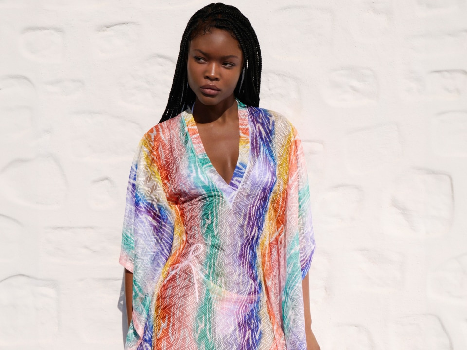 A model is wearing a multicolour cover up from the digital exclusive capsule