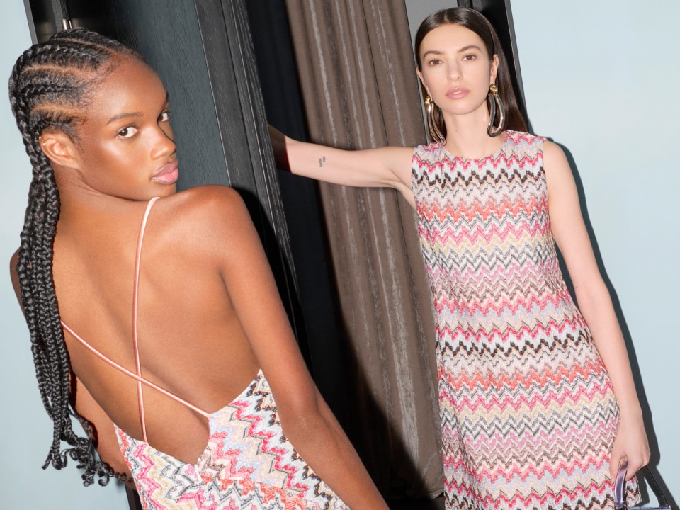 Two models are wearing two dresses in pink and multicolour zig zag