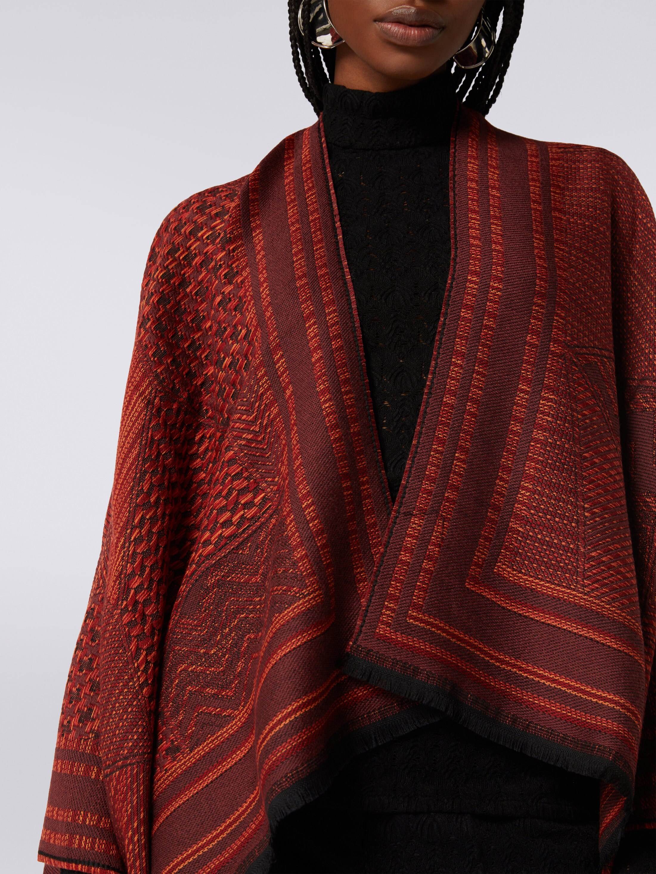 Wool knit cape with multi-worked and frayed edges Multicoloured