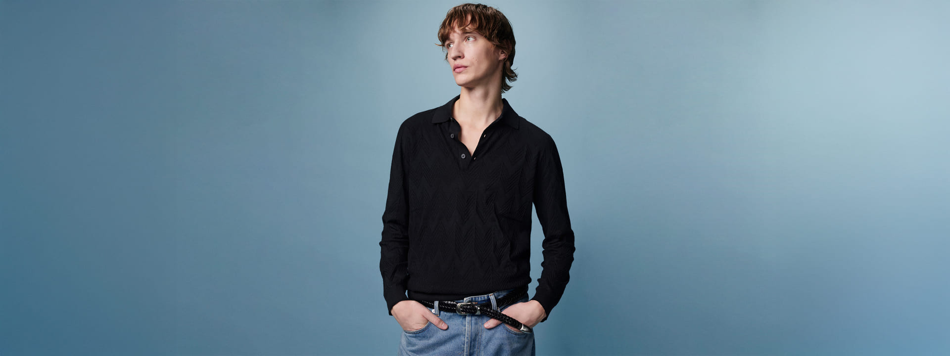 A model is wearing a black shirt