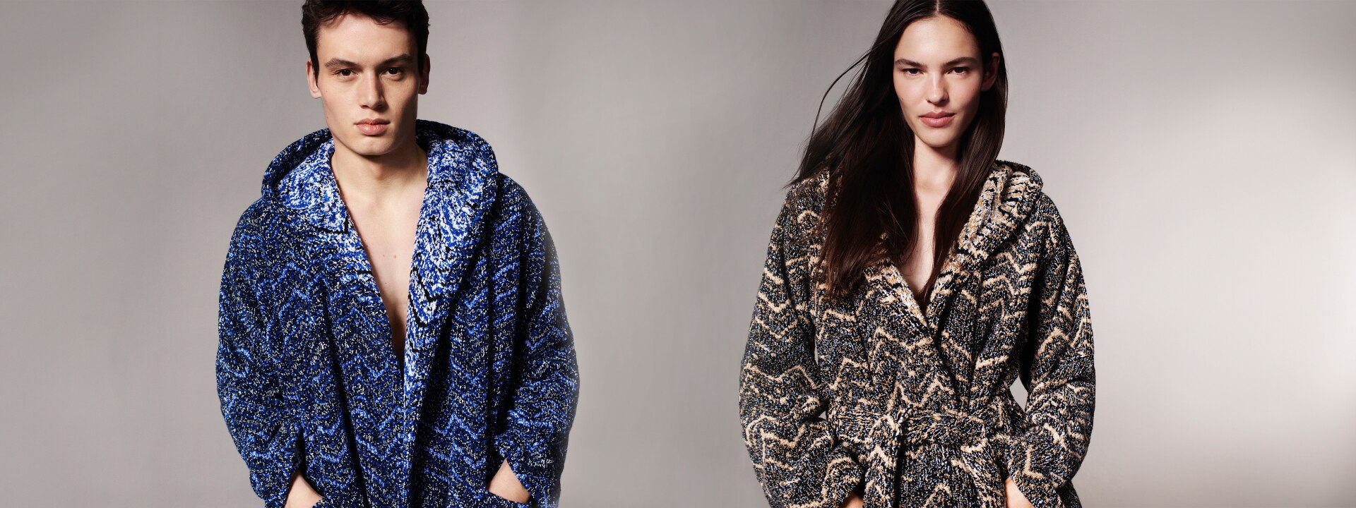 A model is wearing a blue bathrobes, while the second one is wearing a brown bathrobe