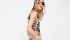 A model is wearing a sleeveless tank top and a pair of trousers, both in zig zag textures
