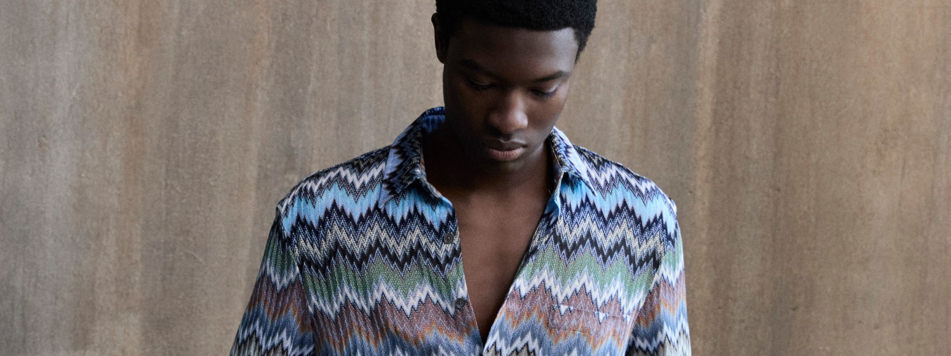 The model wears a gray suit from the new Spring Summer 2023 collection