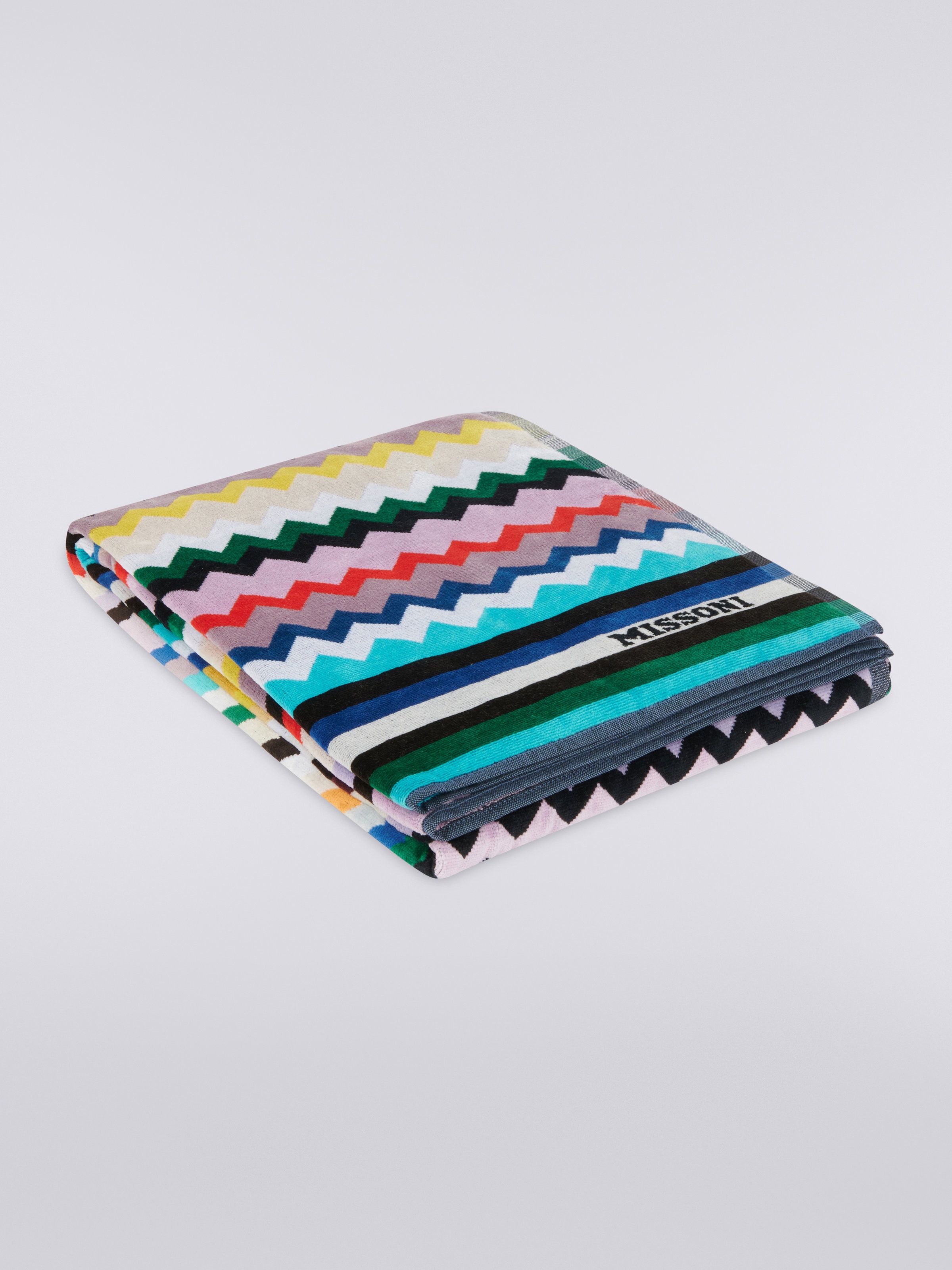 Serviette de plage Carllie 100x180 cm en tissu de coton éponge à chevrons, Multicolore  - 0